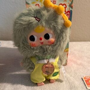 Cute Plush Toy with Green Fur and Yellow Outfit, Chinese zodiac.  SNAKE